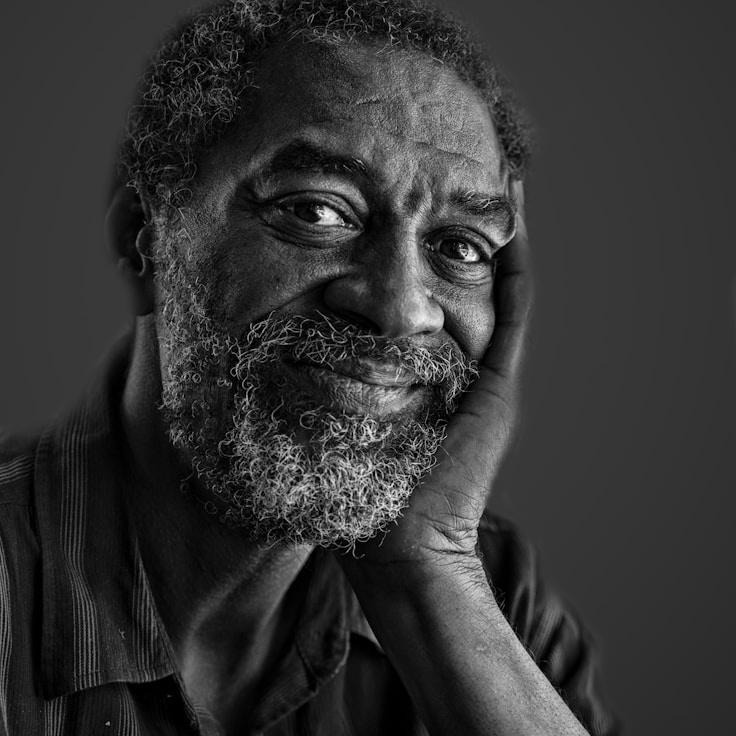 Avery Chen, Lead Design Curator at GardenPlumSummit, reviewing corporate floral arrangements